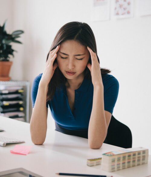 Stressed out woman in home office