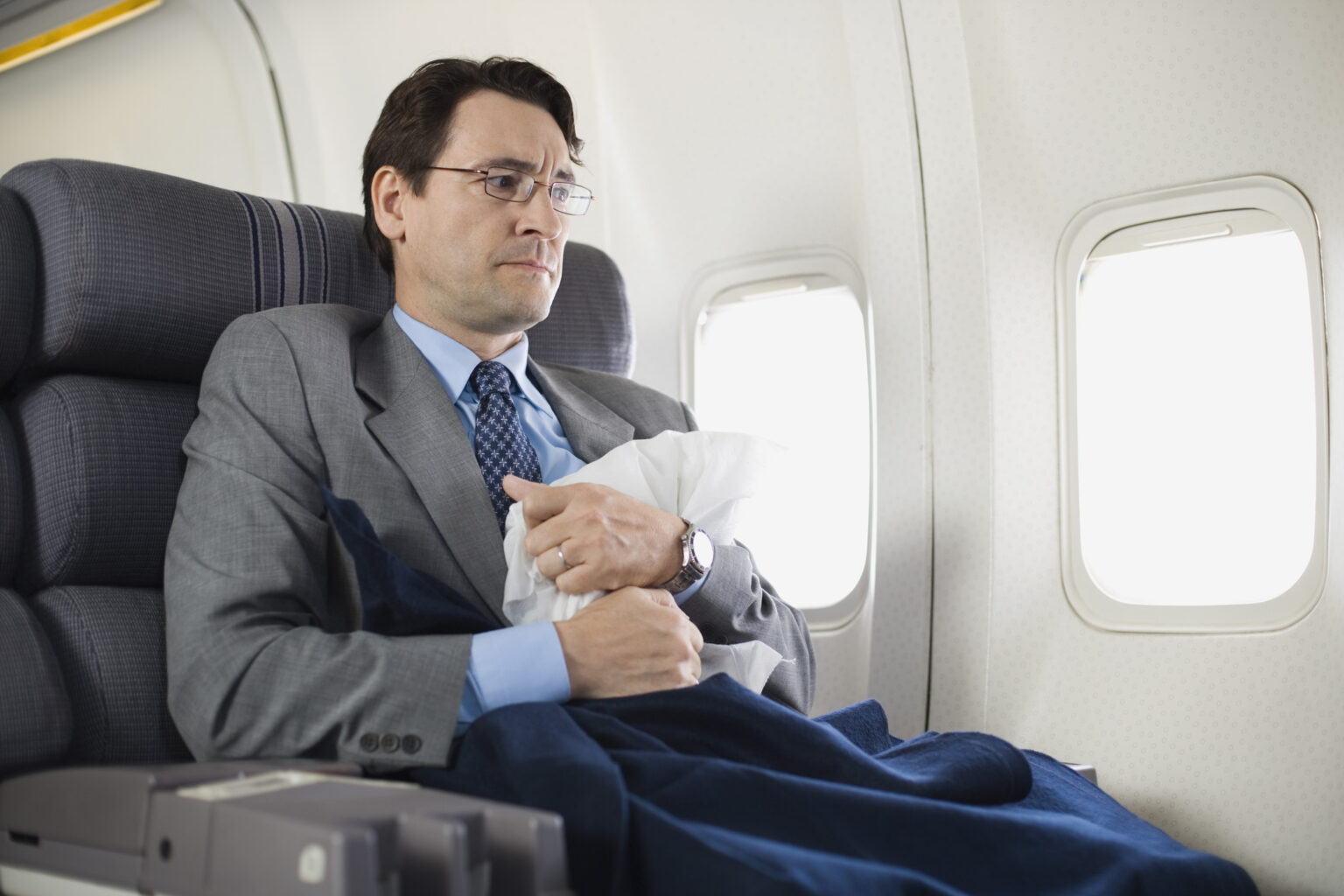 Nervous passenger sitting on airplane