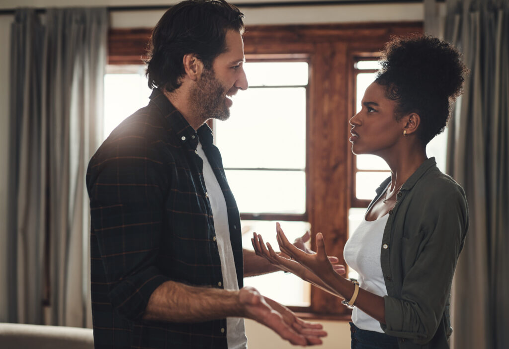 Shot of a young couple having an intense argument at home